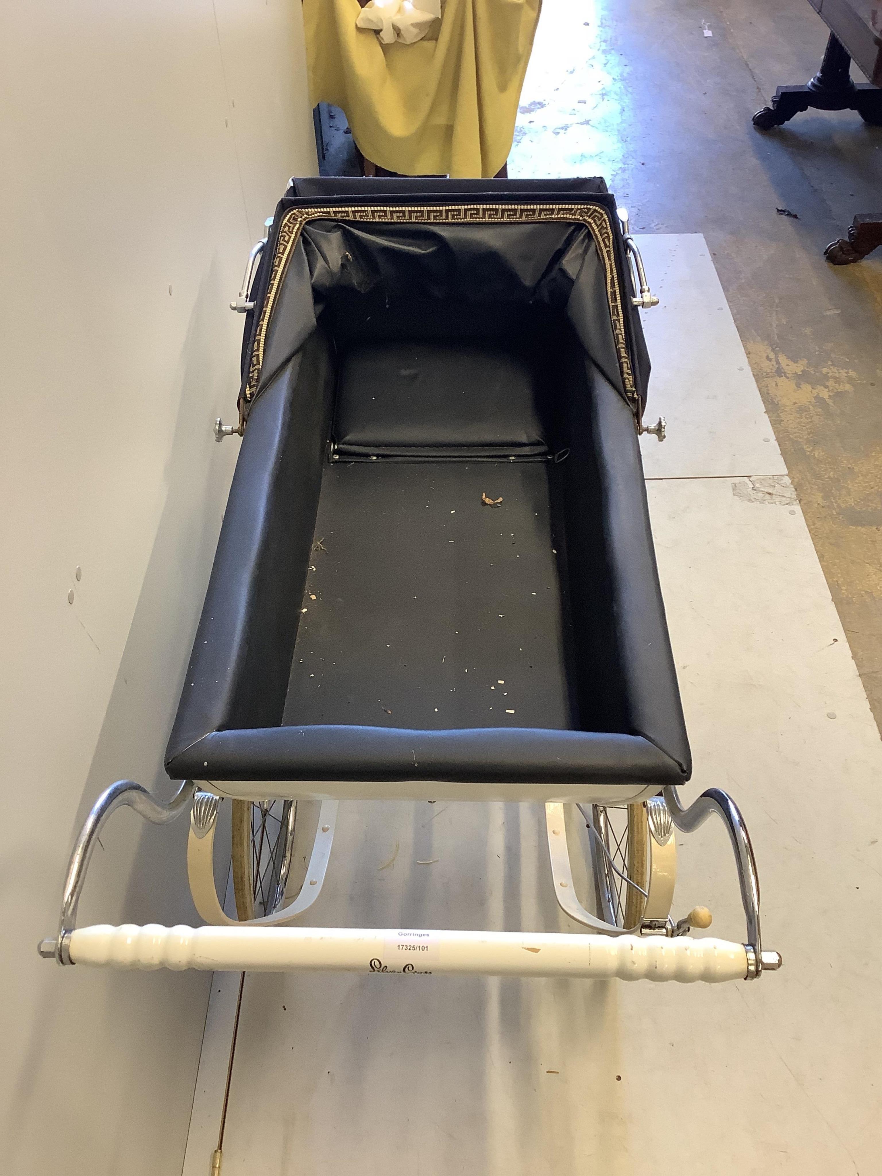 A vintage Silver Cross pram, height 122cm. Condition - fair